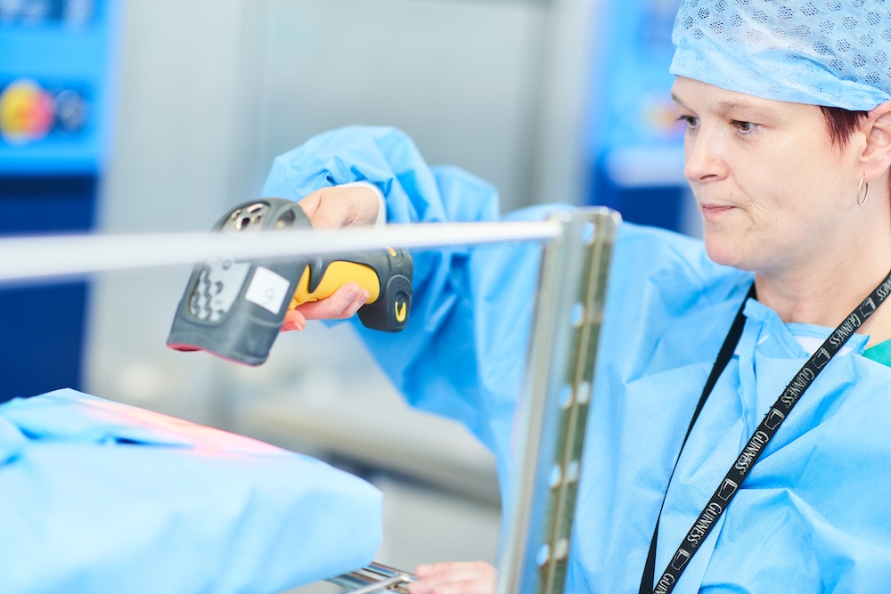 Healthcare worker scanning supplies in a hospital setting